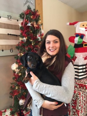 Family member holding dog